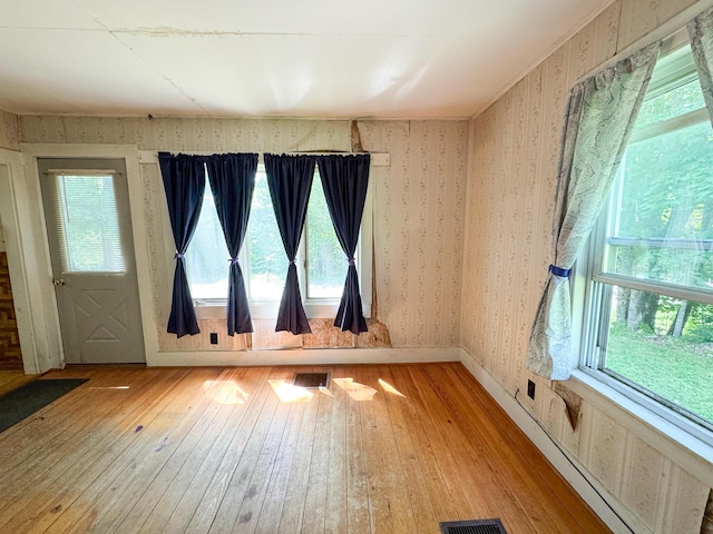 144 Main Rd, Burlington, ME 04417 - spare room with light wood-style floors and wallpapered walls