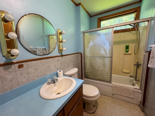 144 Main Rd, Burlington, ME 04417 - full bath featuring tile walls, vanity, enclosed tub / shower combo, a wainscoted wall, and ornamental molding