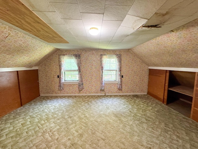 144 Main Rd, Burlington, ME 04417 - additional living space featuring vaulted ceiling, wallpapered walls, and carpet