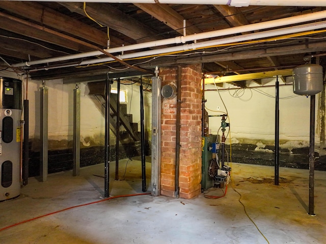 9 Coolidge St, Livermore, ME 04253 - unfinished basement featuring stairway, a heating unit, and heat pump water heater