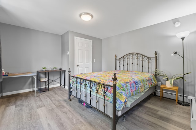 152 Quarry Rd, Limerick, ME 04048 - bedroom with wood finished floors and a baseboard radiator