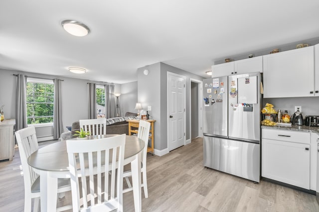 152 Quarry Rd, Limerick, ME 04048 - kitchen with freestanding refrigerator, light wood finished floors, white cabinets, and a baseboard heating unit
