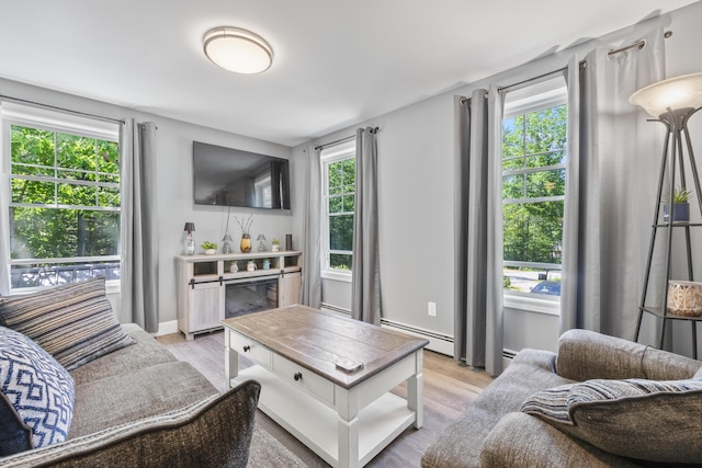 152 Quarry Rd, Limerick, ME 04048 - living room with healthy amount of natural light, a baseboard heating unit, and light wood finished floors