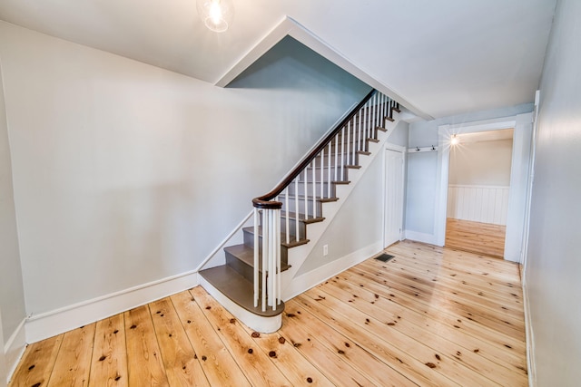 47 Main Rd N, Hampden, ME 04444 - stairway with hardwood / wood-style floors and wainscoting