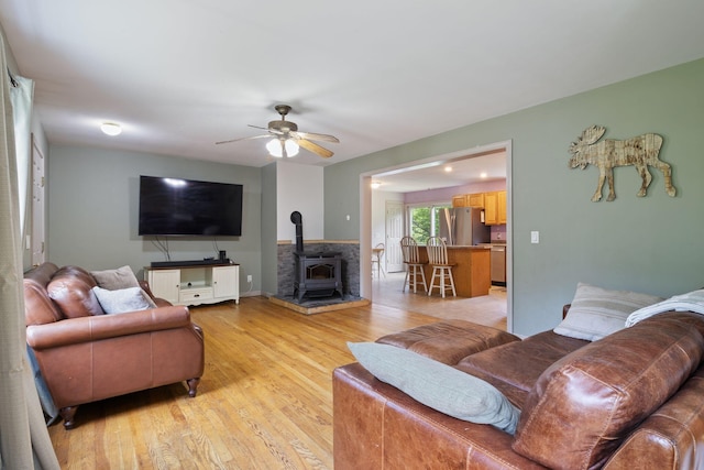 30 Cogliandro Dr, Acton, ME 04001 - living area with a wood stove, light wood-type flooring, and ceiling fan