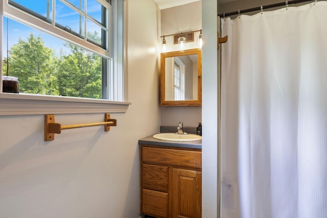 30 Cogliandro Dr, Acton, ME 04001 - bathroom with vanity and a shower with shower curtain