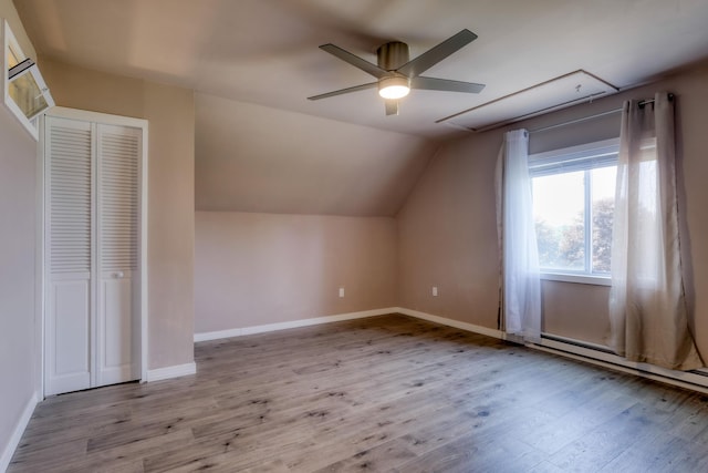 2 Church St, Deer Isle, ME 04627 - additional living space with attic access, lofted ceiling, wood finished floors, a ceiling fan, and a baseboard radiator