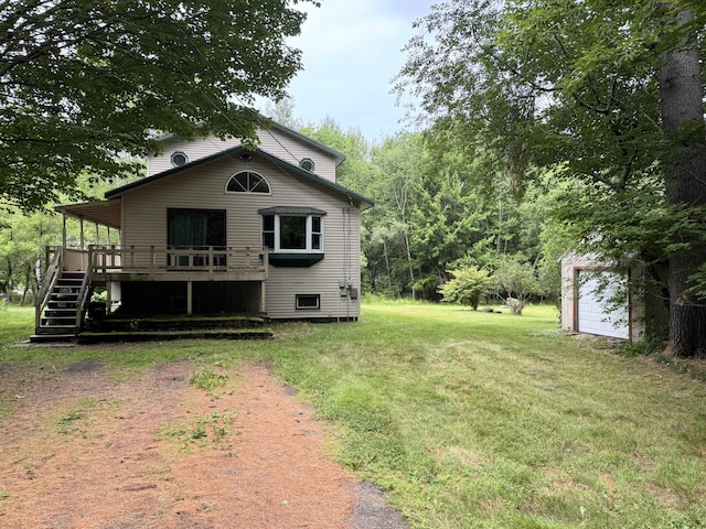 24 N Tiery St, Old Town, ME 04468 - back of property with driveway, a yard, a wooden deck, and stairs