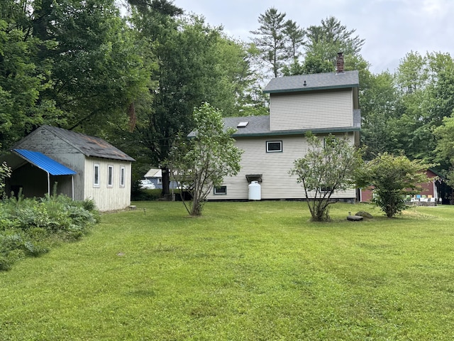 24 N Tiery St, Old Town, ME 04468 - view of green lawn with an outbuilding