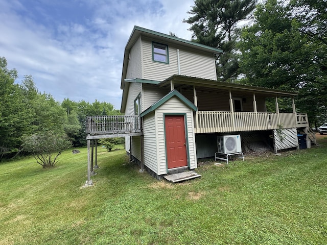24 N Tiery St, Old Town, ME 04468 - rear view of house featuring a lawn and a deck