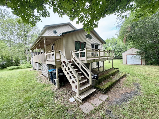24 N Tiery St, Old Town, ME 04468 - back of property featuring an outdoor structure, stairway, a yard, and a deck