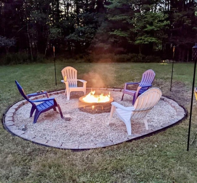 24 N Tiery St, Old Town, ME 04468 - view of patio featuring a fire pit