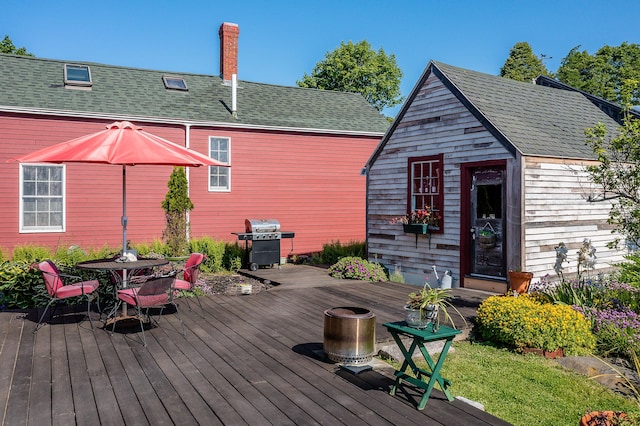 5 Chestnut St, Vinalhaven, ME 04863 - wooden terrace with area for grilling and outdoor dining area