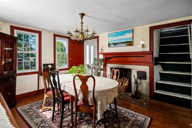 5 Chestnut St, Vinalhaven, ME 04863 - dining room featuring a chandelier, wood-type flooring, and a premium fireplace