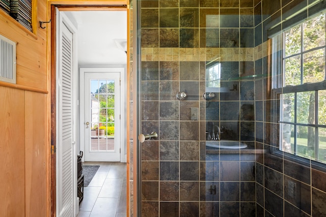 5 Chestnut St, Vinalhaven, ME 04863 - bathroom with tiled shower, tile patterned flooring, and a closet