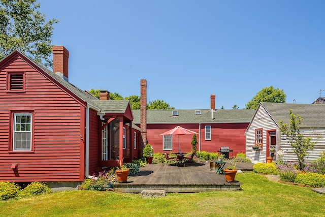 5 Chestnut St, Vinalhaven, ME 04863 - rear view of property with a wooden deck, a yard, and a chimney