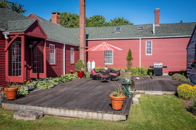 5 Chestnut St, Vinalhaven, ME 04863 - deck featuring a grill, outdoor dining space, and a lawn