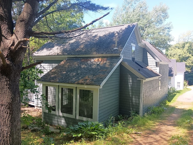 44 Baldwin St, Livermore Falls, ME 04254 - view of side of home featuring roof with shingles