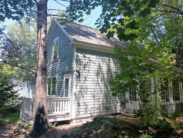 44 Baldwin St, Livermore Falls, ME 04254 - view of side of home featuring a wooden deck and roof with shingles