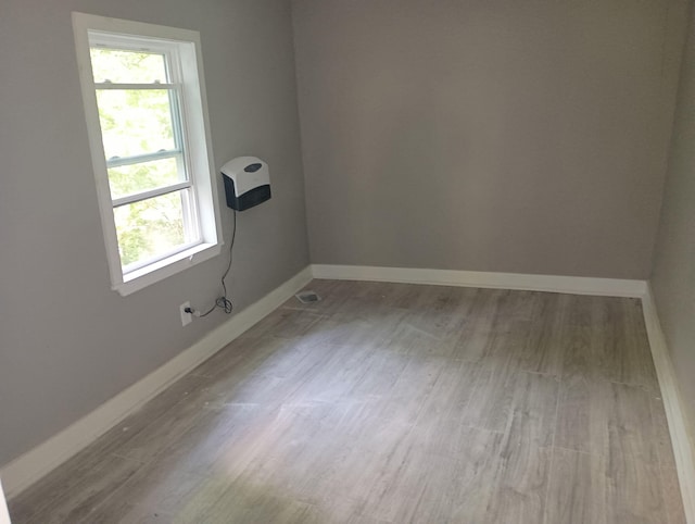 44 Baldwin St, Livermore Falls, ME 04254 - spare room with healthy amount of natural light and wood finished floors