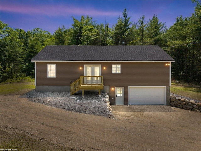 34 Oak Woods Dr, Hiram, ME 04041 - view of front facade featuring french doors, a garage, and dirt driveway