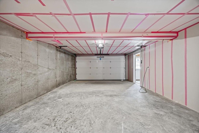 34 Oak Woods Dr, Hiram, ME 04041 - garage featuring a garage door opener
