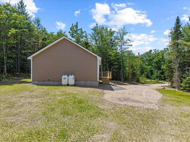 34 Oak Woods Dr, Hiram, ME 04041 - view of side of property with a yard, a view of trees, and a deck