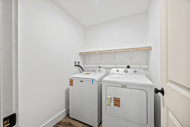 34 Oak Woods Dr, Hiram, ME 04041 - laundry area with washing machine and clothes dryer and dark wood-type flooring