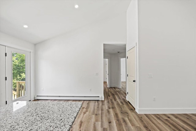 34 Oak Woods Dr, Hiram, ME 04041 - spare room featuring baseboard heating, wood finished floors, and recessed lighting