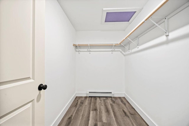 34 Oak Woods Dr, Hiram, ME 04041 - spacious closet featuring a baseboard heating unit and wood finished floors