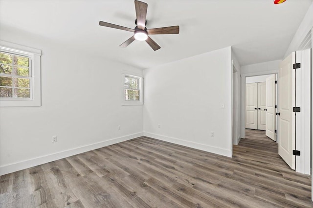 34 Oak Woods Dr, Hiram, ME 04041 - unfurnished room with healthy amount of natural light, wood finished floors, and ceiling fan