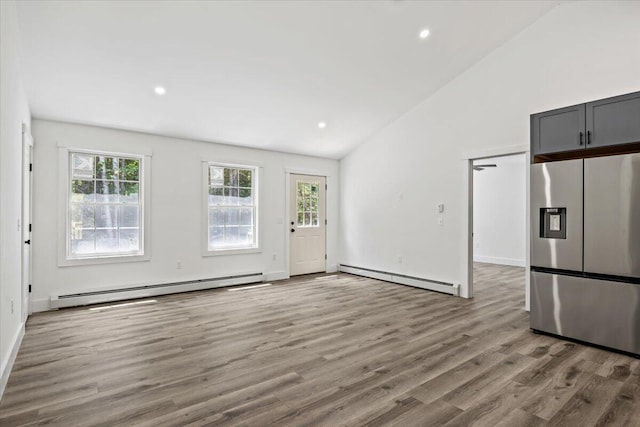 34 Oak Woods Dr, Hiram, ME 04041 - interior space with a baseboard radiator, wood finished floors, recessed lighting, and high vaulted ceiling