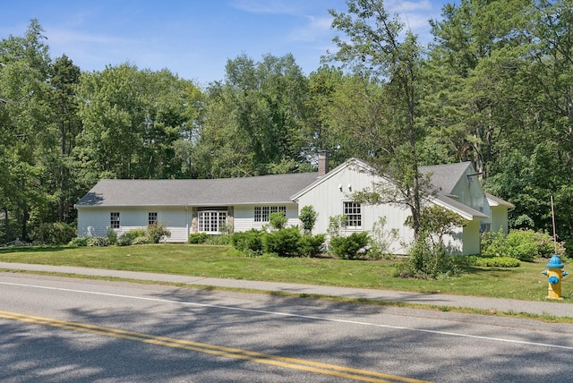 53 Beach Ave, Kennebunk, ME 04043 - ranch-style house featuring a front lawn and a chimney