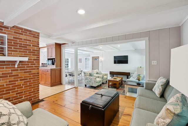 53 Beach Ave, Kennebunk, ME 04043 - living area with light wood finished floors and beamed ceiling
