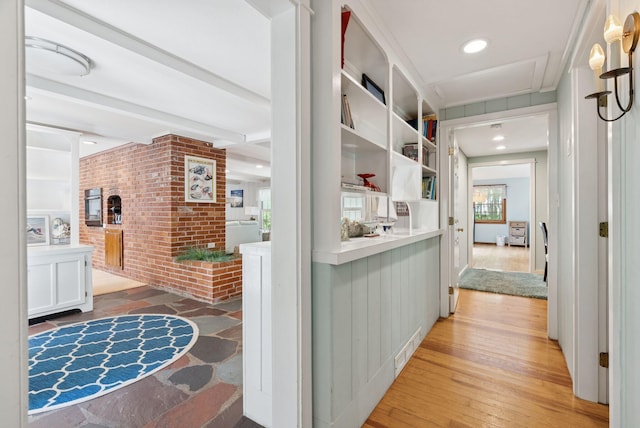 53 Beach Ave, Kennebunk, ME 04043 - corridor featuring light wood-type flooring, recessed lighting, beam ceiling, and brick wall