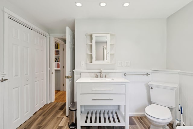 53 Beach Ave, Kennebunk, ME 04043 - bathroom with a closet, vanity, wood finished floors, and recessed lighting