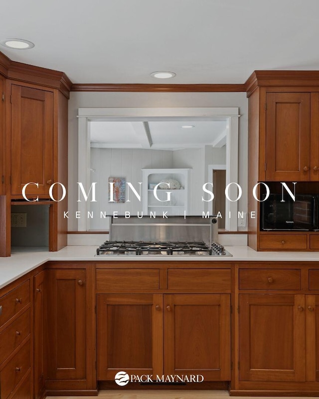 53 Beach Ave, Kennebunk, ME 04043 - kitchen with stainless steel gas stovetop, brown cabinetry, light countertops, and recessed lighting