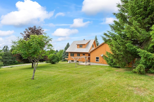 11 Overlook Rd, Rangeley, ME 04970 - back of house with a metal roof and a lawn