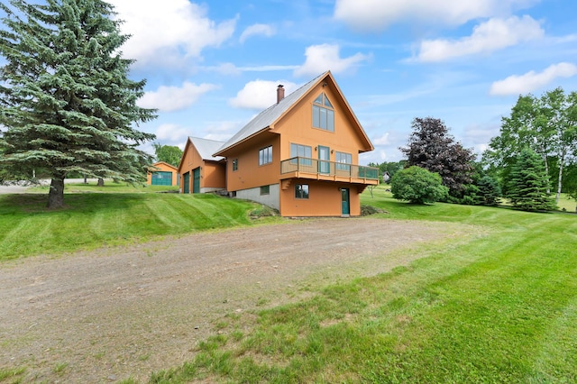 11 Overlook Rd, Rangeley, ME 04970 - view of side of property with driveway, a chimney, and a yard