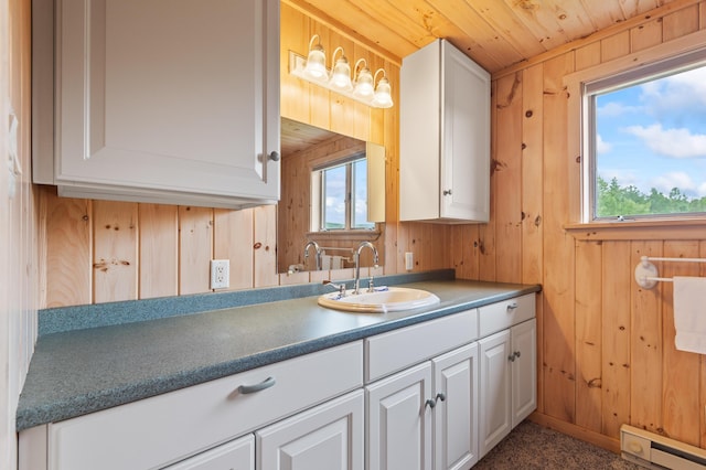 11 Overlook Rd, Rangeley, ME 04970 - bathroom featuring a baseboard radiator, wooden walls, healthy amount of natural light, wood ceiling, and vanity
