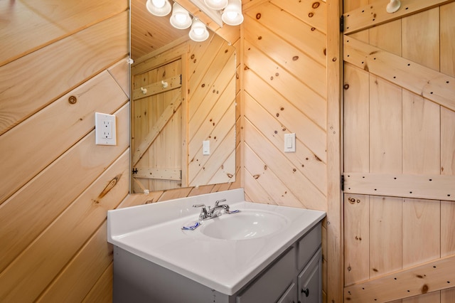 11 Overlook Rd, Rangeley, ME 04970 - bathroom with vanity and wooden walls