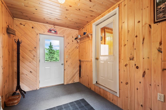 11 Overlook Rd, Rangeley, ME 04970 - doorway with carpet floors, wood walls, and wood ceiling