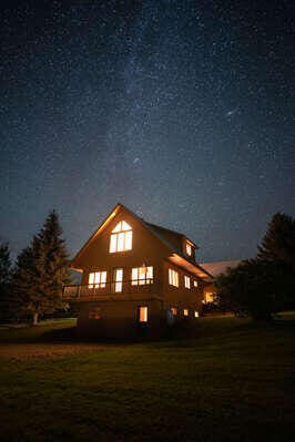 11 Overlook Rd, Rangeley, ME 04970 - property exterior at twilight featuring a yard