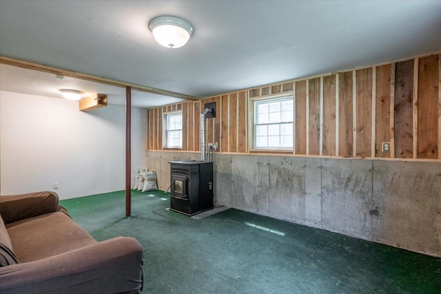 415 Waldoboro Rd, Jefferson, ME 04348 - below grade area featuring a wood stove and carpet