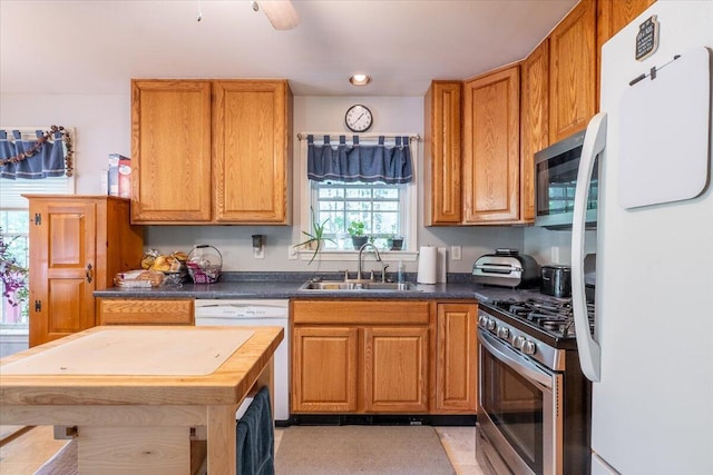 415 Waldoboro Rd, Jefferson, ME 04348 - kitchen featuring white appliances, dark countertops, brown cabinetry, and recessed lighting
