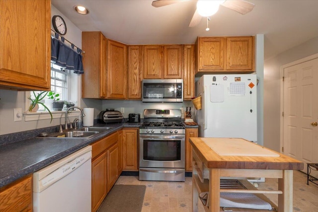 415 Waldoboro Rd, Jefferson, ME 04348 - kitchen with stainless steel appliances, brown cabinets, a ceiling fan, recessed lighting, and butcher block counters