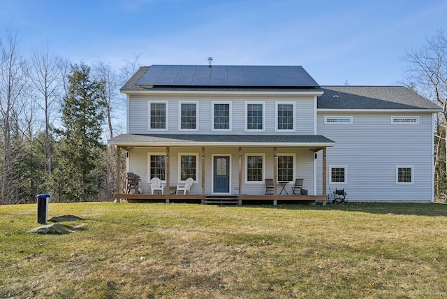 5 Harmony Way, Falmouth, ME 04105 - view of front facade featuring solar panels, a front yard, and covered porch