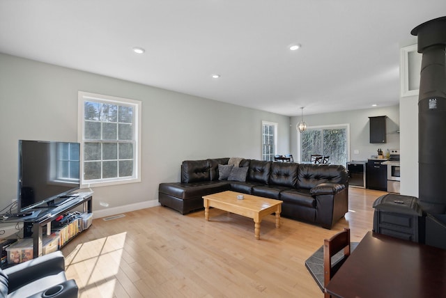 5 Harmony Way, Falmouth, ME 04105 - living room with healthy amount of natural light, light wood finished floors, and recessed lighting