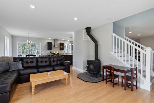 5 Harmony Way, Falmouth, ME 04105 - living room featuring light wood-type flooring, recessed lighting, a wood stove, and stairway