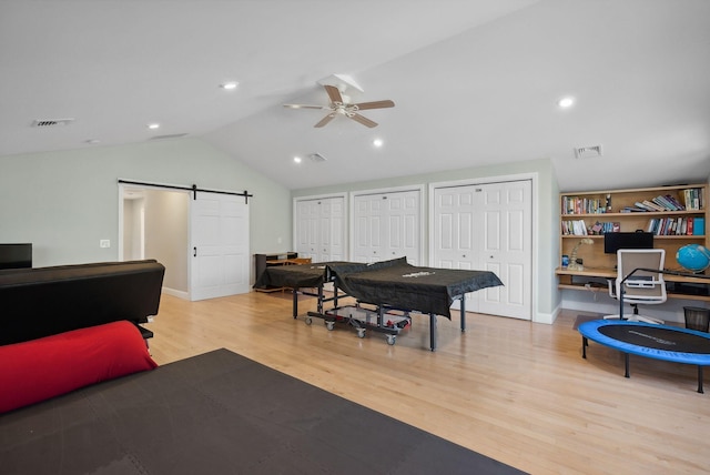 5 Harmony Way, Falmouth, ME 04105 - rec room featuring a barn door, ceiling fan, wood finished floors, an office area, and lofted ceiling
